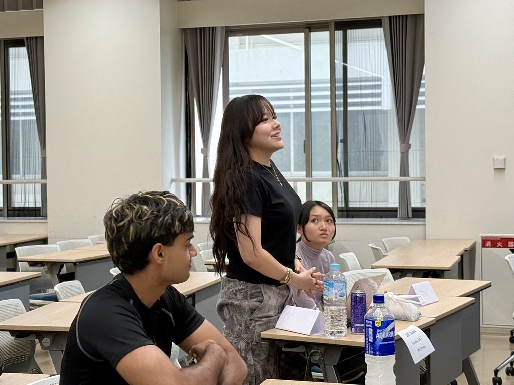 A Soka University student participating in a global business discussion with Rachel Leng