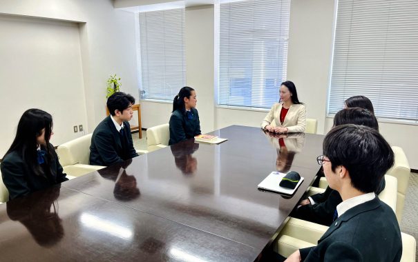 female leader and students at the meeting